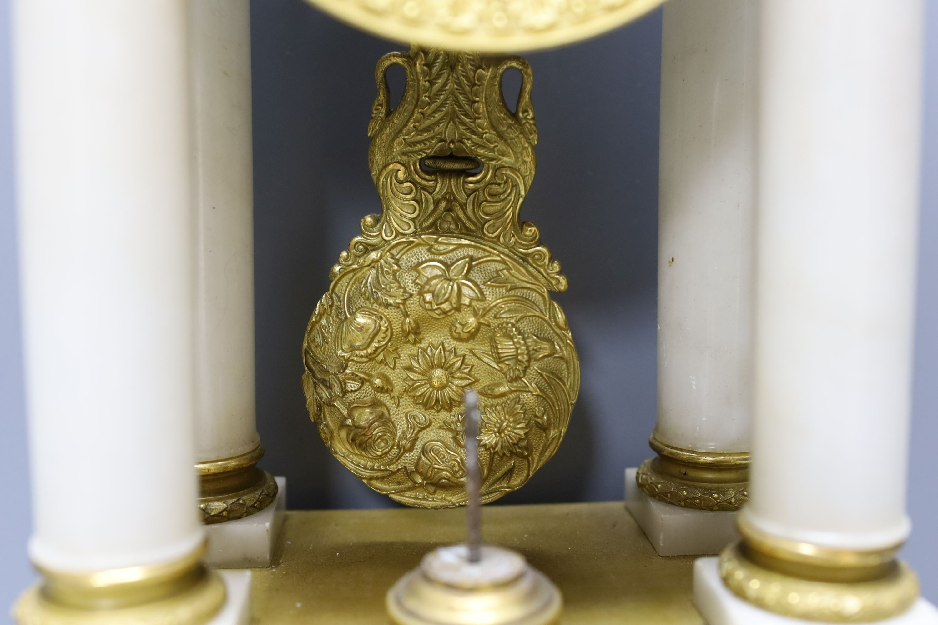 A 19th-century French ormolu and alabaster portico clock 53cm